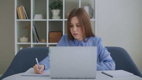 Focused-business-woman-entrepreneur-typing-on-laptop-doing-research.-Young-female-professional-using-computer-sitting-at-home-office-desk.-Busy-worker-freelancer-working-on-modern-tech-notebook-device
